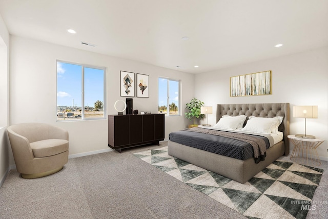 bedroom with multiple windows, visible vents, and carpet floors