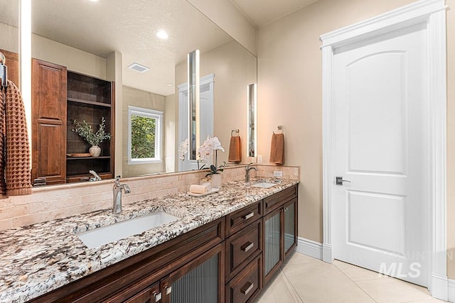 1452 S Hidden Island Pl, Eagle, ID 83616 - full bath with double vanity, tile patterned floors, and recessed lighting