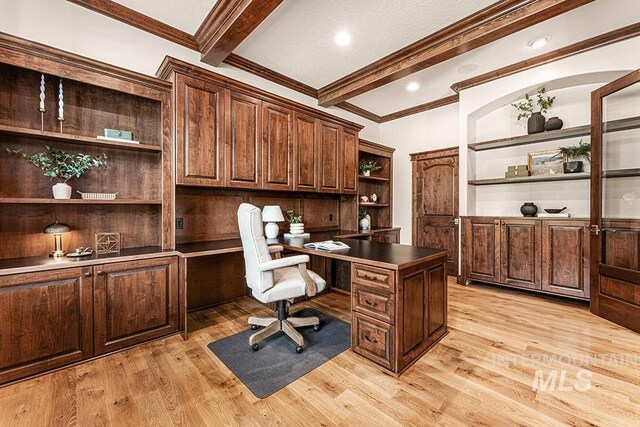 1452 S Hidden Island Pl, Eagle, ID 83616 - office area featuring built in desk, beamed ceiling, light wood-style floors, and ornamental molding