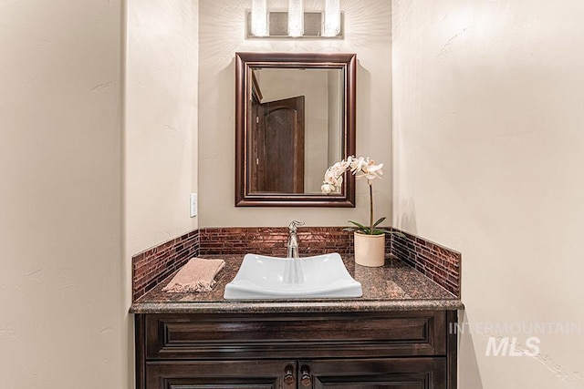 1452 S Hidden Island Pl, Eagle, ID 83616 - bathroom featuring vanity and backsplash