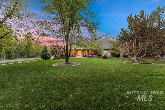 1452 S Hidden Island Pl, Eagle, ID 83616 - yard at dusk with a lawn