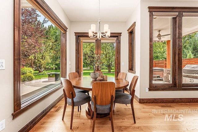 1452 S Hidden Island Pl, Eagle, ID 83616 - dining area featuring a chandelier and light wood-type flooring