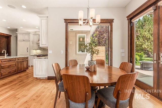 1452 S Hidden Island Pl, Eagle, ID 83616 - dining space with a chandelier, light wood-type flooring, and recessed lighting
