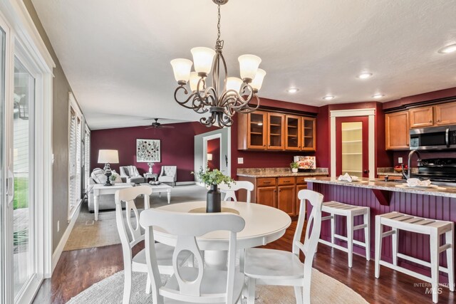810 N Eagle Hills Way, Eagle, ID 83616 - dining area featuring dark wood-style flooring, a ceiling fan, recessed lighting, a desk, and a chandelier