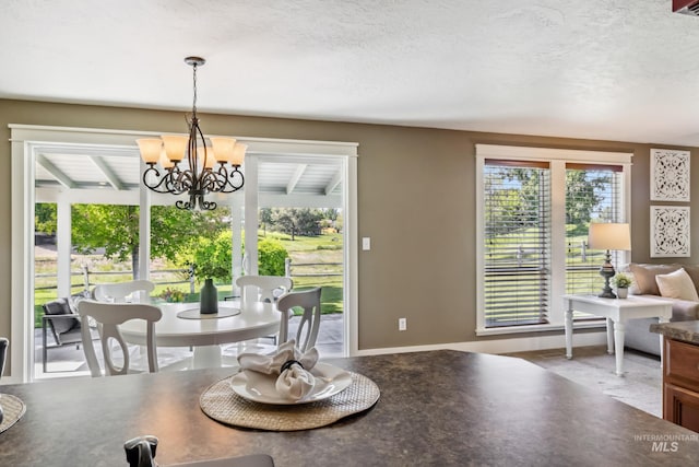 810 N Eagle Hills Way, Eagle, ID 83616 - dining space featuring a chandelier and a textured ceiling