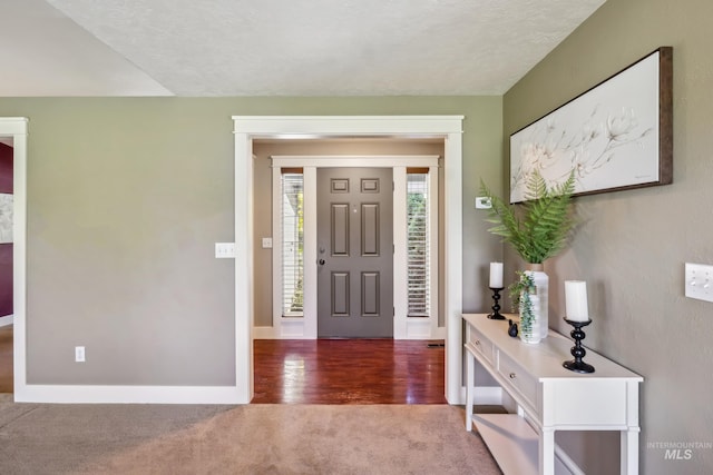 810 N Eagle Hills Way, Eagle, ID 83616 - foyer entrance with carpet, baseboards, and wood finished floors