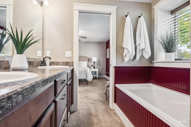 810 N Eagle Hills Way, Eagle, ID 83616 - ensuite bathroom with double vanity, a garden tub, and a ceiling fan