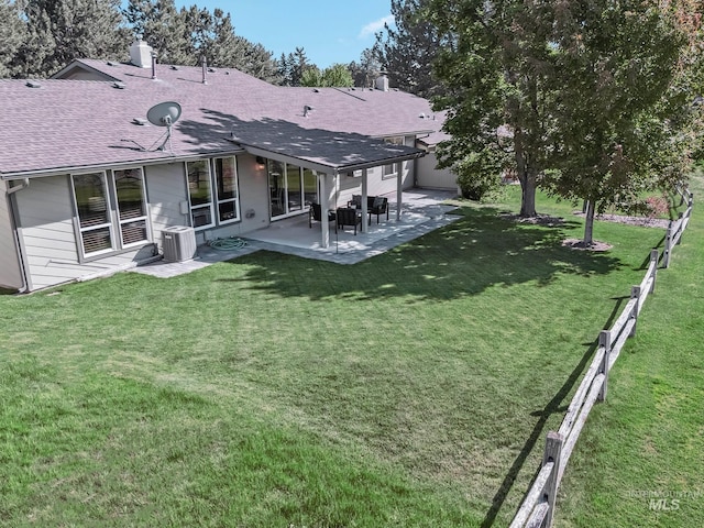 810 N Eagle Hills Way, Eagle, ID 83616 - rear view of property with roof with shingles, central AC unit, a patio area, and a chimney