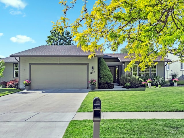 810 N Eagle Hills Way, Eagle, ID 83616 - view of front of house with a garage, a front yard, driveway, and roof with shingles