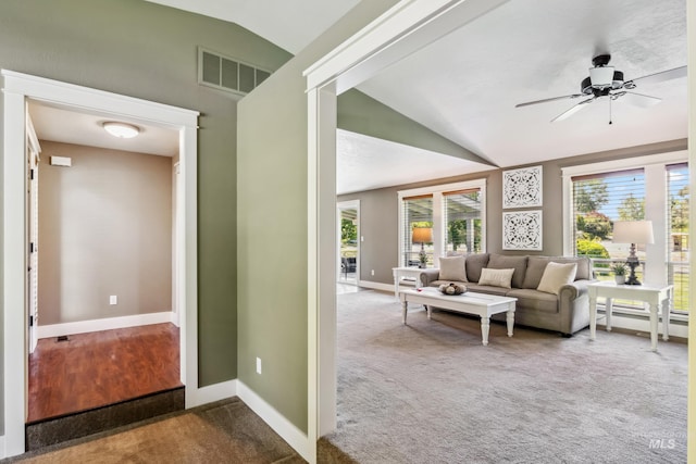 810 N Eagle Hills Way, Eagle, ID 83616 - carpeted living room featuring vaulted ceiling, baseboards, ceiling fan, and a baseboard radiator