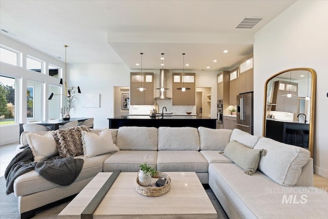 living room featuring sink