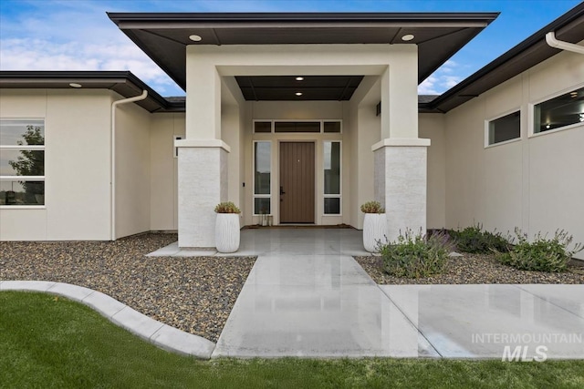 doorway to property featuring a patio area