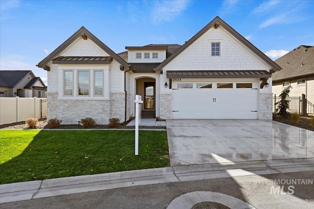 view of front facade featuring a garage and a front lawn