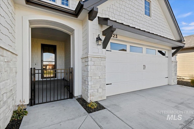 view of exterior entry with a garage