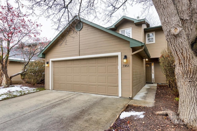 view of front of property with a garage