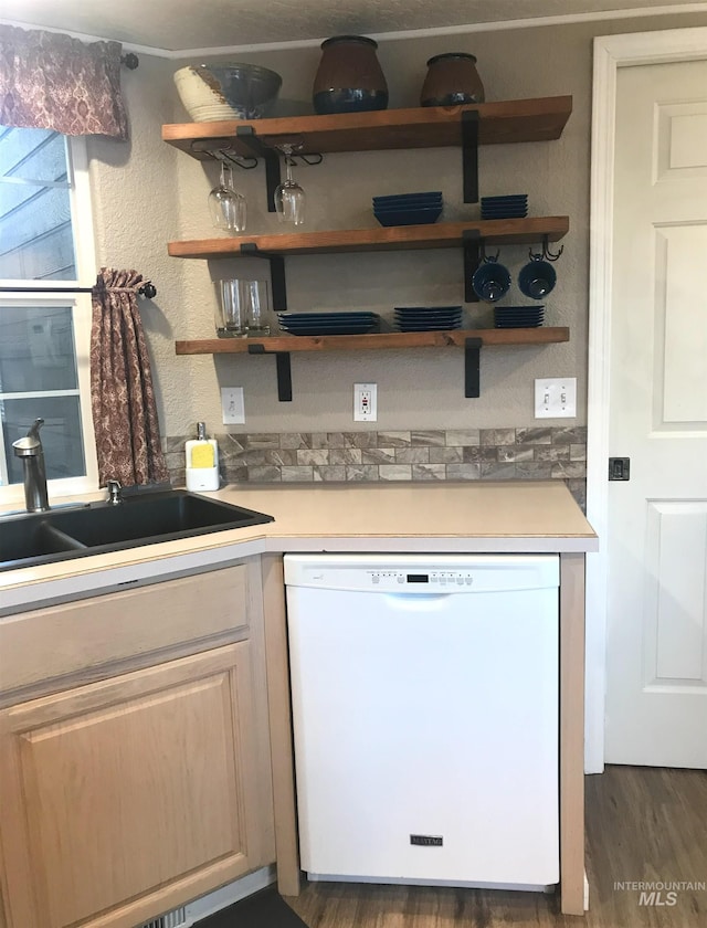kitchen with dishwasher, light countertops, and open shelves