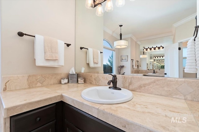 bathroom featuring vanity and crown molding