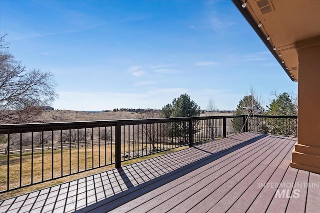 wooden deck with visible vents