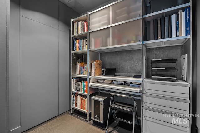 home office with tile patterned floors