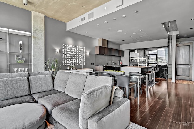 living room featuring dark wood finished floors and recessed lighting