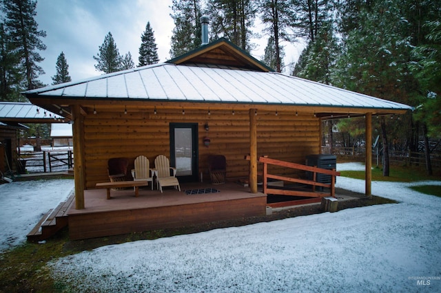 exterior space featuring cooling unit and a wooden deck