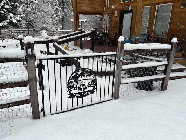 view of snow covered gate