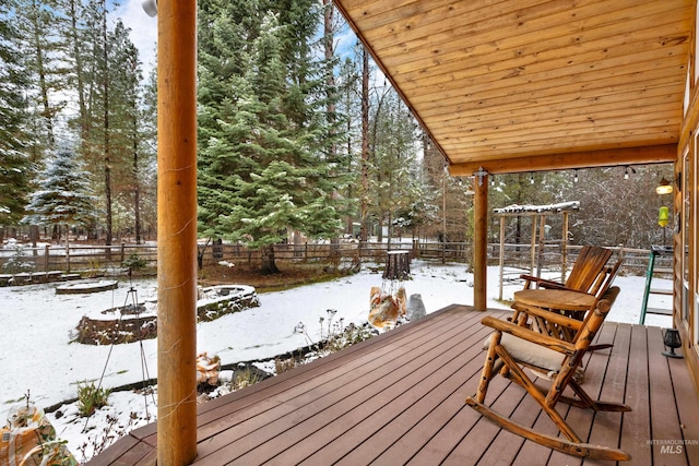 view of snow covered deck