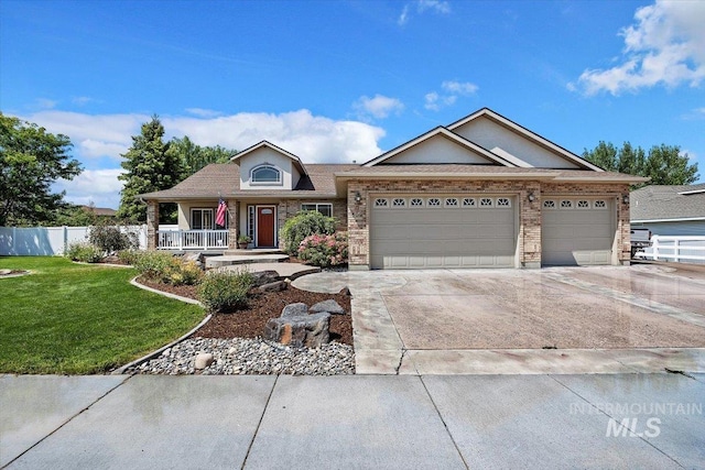 view of front of home with a porch, a front lawn, and a garage