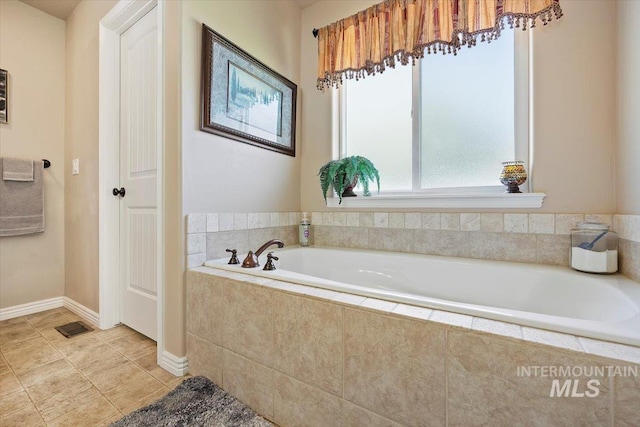 bathroom featuring tiled bath