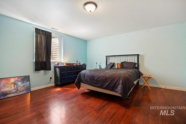 bedroom featuring dark hardwood / wood-style floors