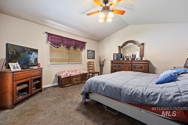 bedroom with carpet floors, ceiling fan, and vaulted ceiling