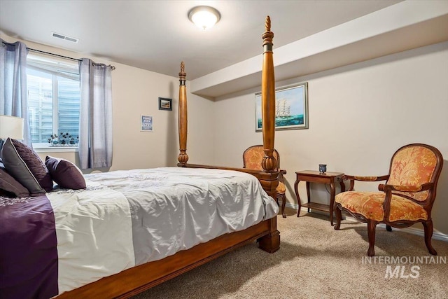 bedroom featuring light carpet