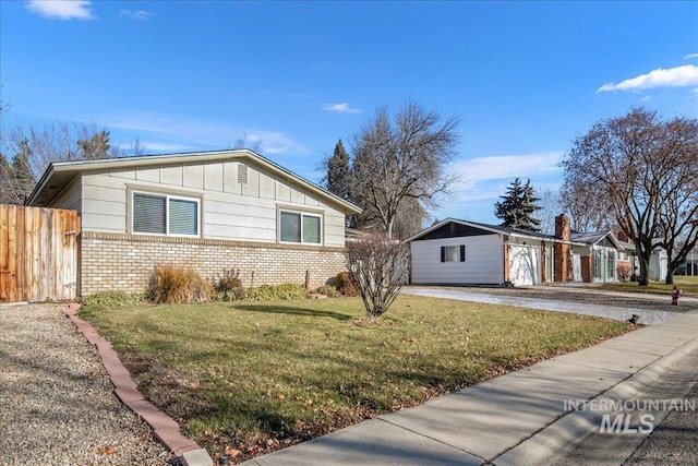 view of home's exterior featuring an outdoor structure and a lawn