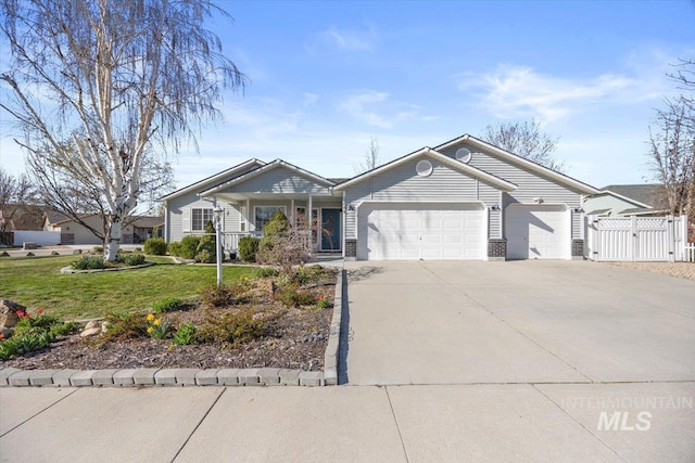 single story home with a garage, fence, a front lawn, a gate, and driveway