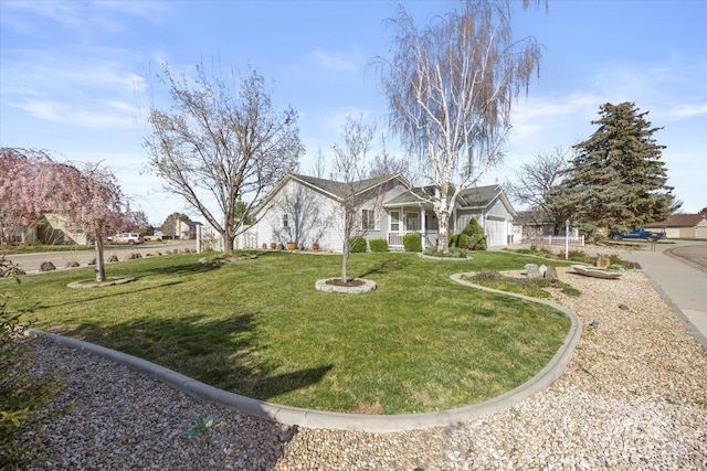 exterior space featuring a garage and a lawn