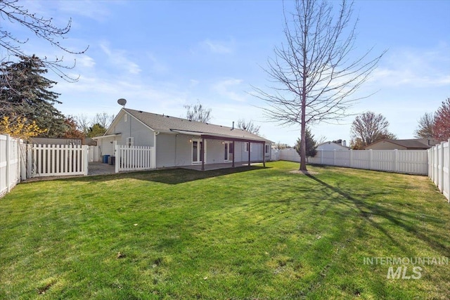 view of yard with a fenced backyard