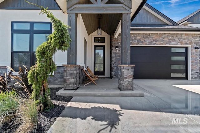 view of exterior entry featuring a garage