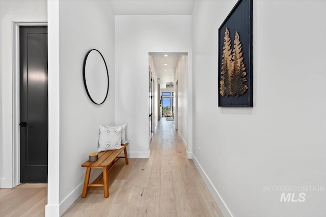 hallway with light wood-type flooring