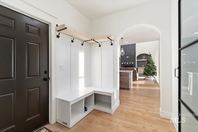 mudroom with light hardwood / wood-style floors