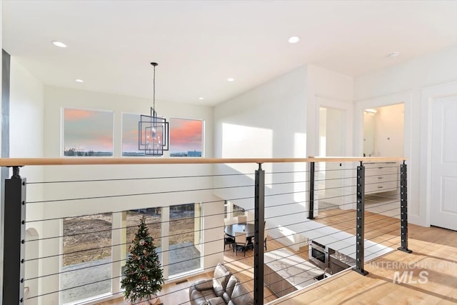 corridor with hardwood / wood-style floors