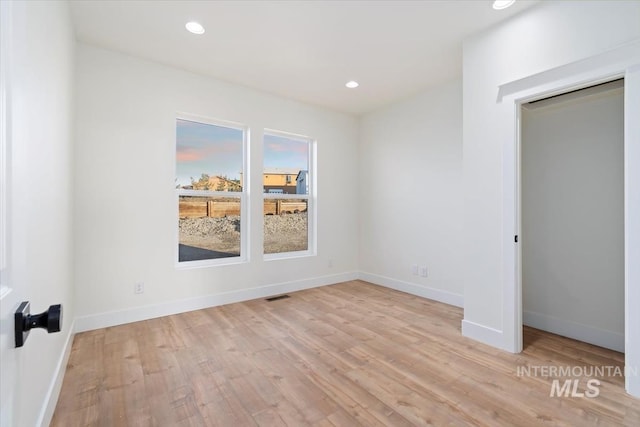 unfurnished bedroom featuring light hardwood / wood-style floors