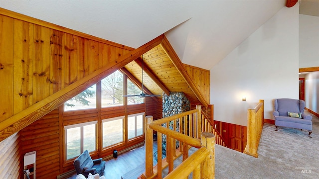 interior space with rustic walls and high vaulted ceiling