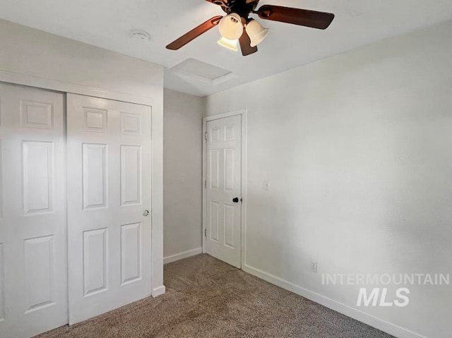 unfurnished bedroom featuring a closet, ceiling fan, and carpet floors