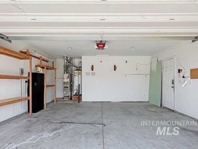 garage with a garage door opener and gas water heater