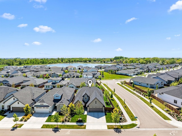birds eye view of property with a residential view