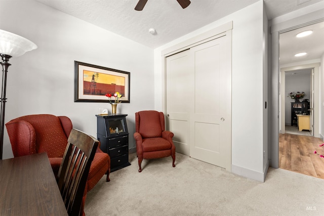 sitting room featuring baseboards, recessed lighting, carpet, and ceiling fan