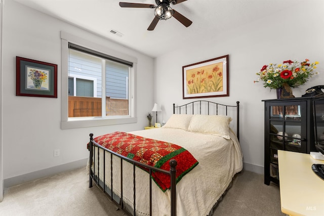 bedroom featuring visible vents, carpet flooring, baseboards, and a ceiling fan