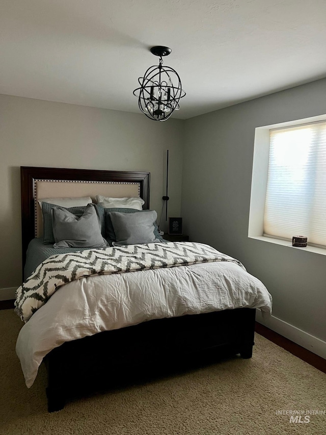 bedroom featuring a chandelier