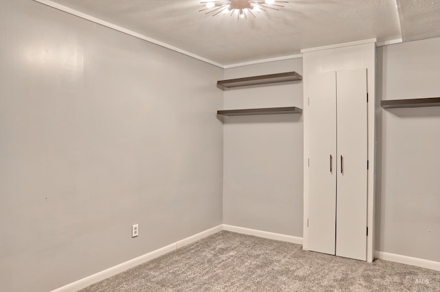 unfurnished bedroom featuring carpet flooring and baseboards