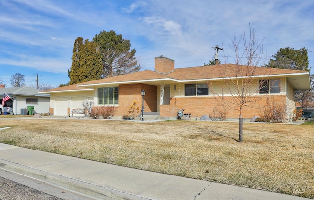 ranch-style house featuring a front lawn, brick siding, a chimney, and an attached garage